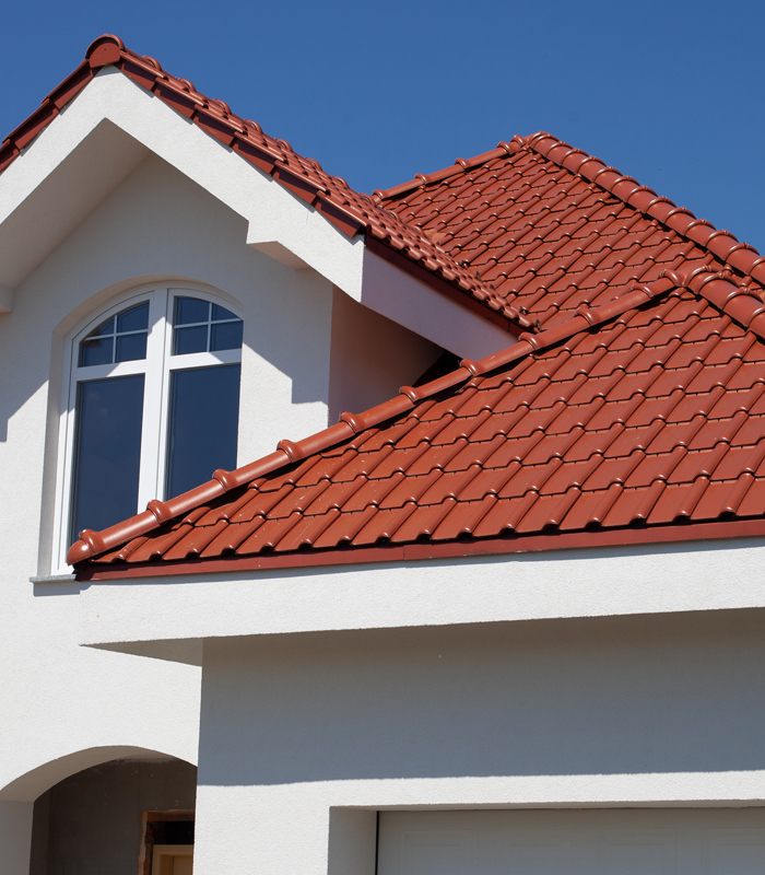 http://Tiled%20roof%20building%20completed%20by%20Western%20Family%20Solutions%20LLC,%20showcasing%20quality%20craftsmanship%20in%20an%20Orange%20Lake%20roofing%20project.